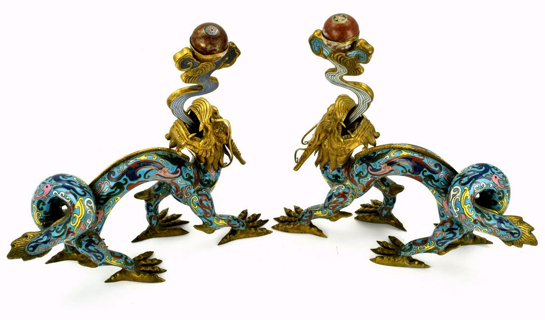 Pair Exclusive Chinese Cloisonne Dragon Candlesticks: Very fine pair large Chinese cloisonne candlesticks depicting five claws Imperial dragons. Impressive piece of Asian art. 13" height, and 13" long.Provenance - private collection of Denver antique dea