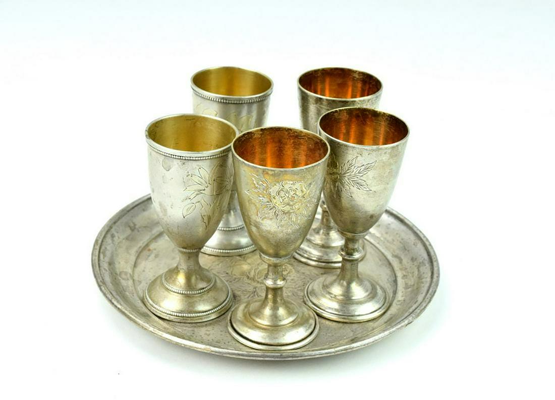 Set 5 Imperial Russian Silver Vodka Cups With Tray: Fine antique Imperial Russian set of five flower engraved vodka cups with matching tray. Two cups slightly different design. Hallmarked with Imperial Russian silver marks. Each cup is 3", tray is 5 1/