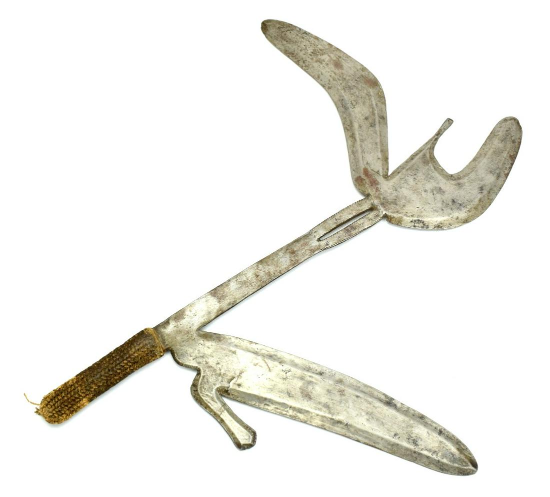 Large African Tribal Throwing Knife: Large African Tribal Throwing Knife. Wicked tribal weapon with multiple blade protrusions designed for maximizing the chance of hitting its target at throwing. Straw wrapped grip. Old auction tag atta