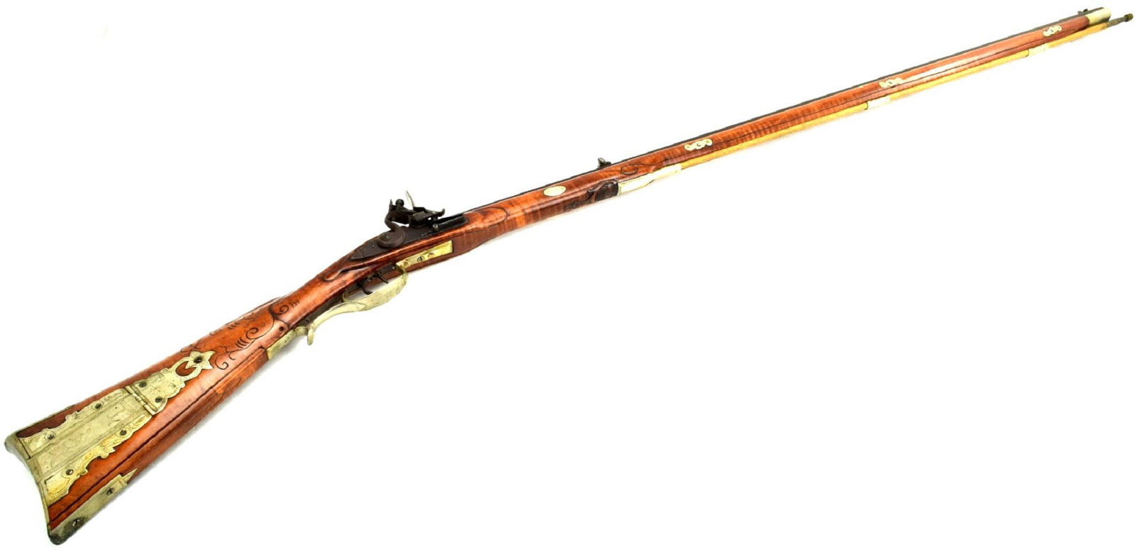 This is an excellent 1980s copy of a 1780s flintlock: This is an excellent 1980s copy of a 1780s flintlock Kentucky rifle. The rifle features correct tiger striped American maple stock. Mounts, butt plate. decorative accents and patch box are finished in