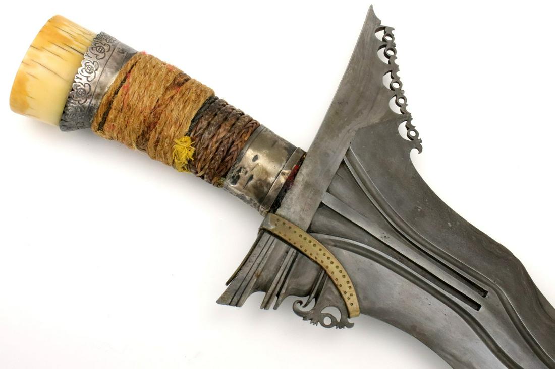 Unusual Early 20th C. Philippine Moro Kris Sword ~ Rare: This is a classic sword of the Moro people of the southern Philippines and of the Sulu Sea areacalled a kris. The classic Moro kris is based heavily on the Indonesian keris but is distinctlylarger and