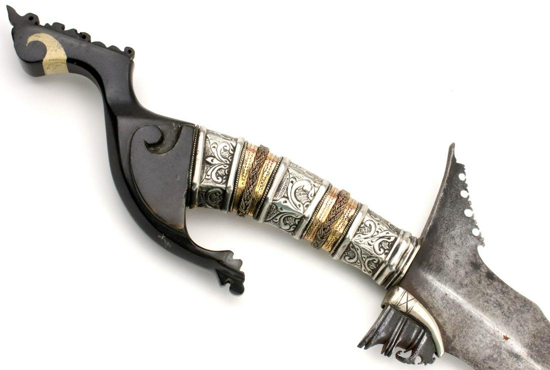 Very Fine early 20th C. Philippine Moro Datu's KRIS: This is a classic sword of the Moro people of the southern Philippines and of the Sulu Sea areacalled a kris. The classic Moro kris is based heavily on the Indonesian keris but is distinctlylarger and