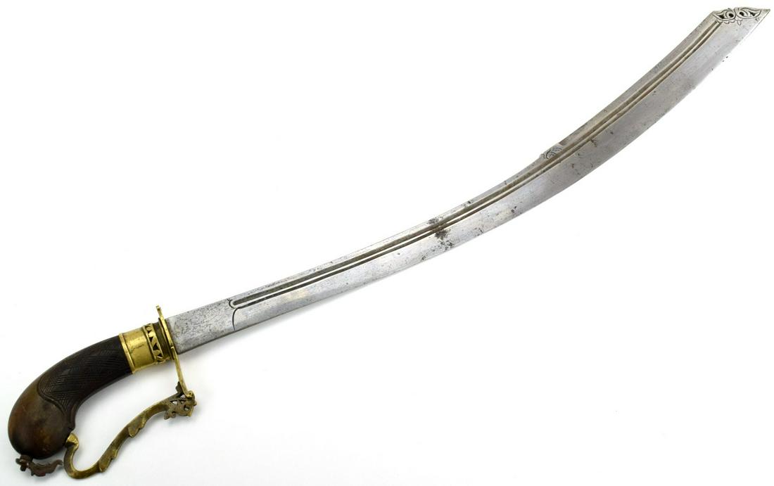 Rare 19th C. Indonesian Malaysian BELADAH BELABANG: A rare form of a classic Indonesian sword, called the beladah belabang, thisexample in the Schmiedt Collection has the classic form of the sword with the pistol grippedhandle and the upswept blade tha