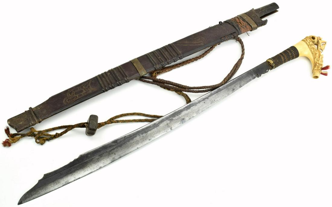 Very Good 19th C. Indonesian MANDAU Parang Ihlang Sword: A distinctive Bornean sword of the Iban Dayak, called a Mandau or Parang Ihlang, these swords are found throughout institutional and private collections in varying degrees of quality. They are disting
