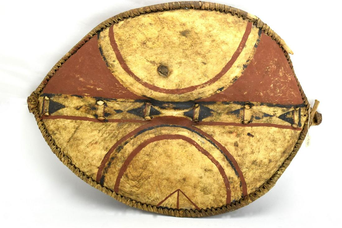 Very Large 19th - early 20th C. African MASAI Tribe: Very Large 19th - early 20th C. African MASAI Tribe Hide War Shield. Size : 33" x 29 1/2"Detailed condition reports are not included in this catalog. For additional information, including condition re