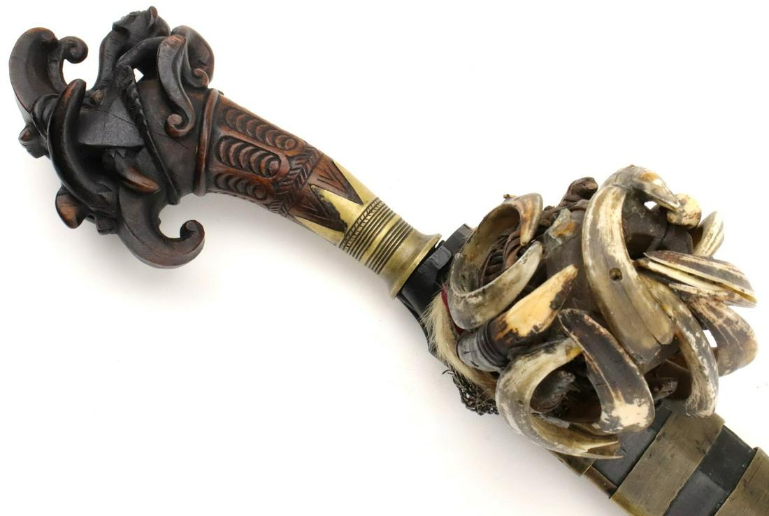 Rare Indonesian Nias BALATO Sword ~ Dayak Headhunters ~: A rare sword of the Nias islands near Sumatra, this sword is called a balato and isof the classic balato form but with the distinctive carved hilt in the form of a dragonhead called alasara. The balat