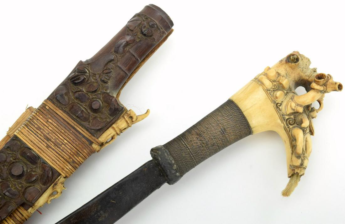 Very Good 19th-early 20th C. MANDAU Parang Ihlang Sword: A distinctive Bornean sword of the Iban Dayak, called a Mandau or Parang Ihlang,these swords are found throughout institutional and private collections in varying degrees ofquality. They are distingui