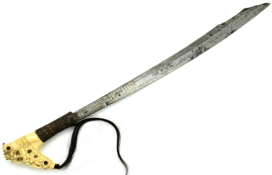 Rare 19th-early 20th C. MANDAU Parang Ihlang Sword ~: A distinctive Bornean sword of the Iban Dayak, called a mandau, these swords arefound in institutional and private collections in varying degrees of quality. They aredistinguished by a set of similar 