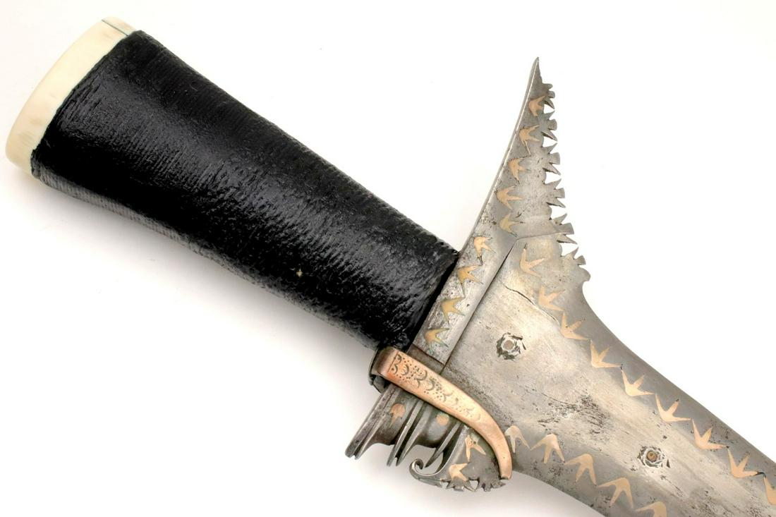 Unusual 19th-early 20th C. Philippine Talismanic Moro: This is a classic sword of the Moro people of the southern Philippines and of the Sulu Sea area called a kris. The classic Moro kris is based heavily on the Indonesian keris but is distinctlylarger an