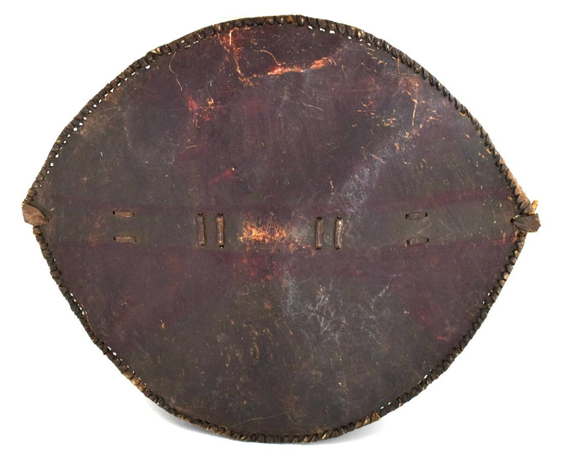 Very Large 19th - early 20th C. African Masai Tribe: Very Large 19th - early 20th C. African Masai Tribe Painted Cowhide War ShieldProvenance Schmiedt collection. Total size : 37" x 29"Detailed condition reports are not included in this catalog. For add