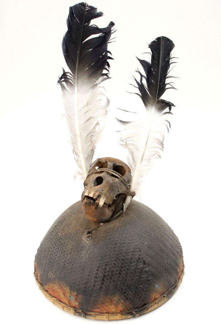 Rare 19th-20th C. Indonesian Konyak Naga Headhunter: Rare 19th-20th C. Indonesian Konyak Naga Headhunter's Helmet Hat with Monkey Skull Decoration. Detailed condition reports are not included in this catalog. For additional information, including condit