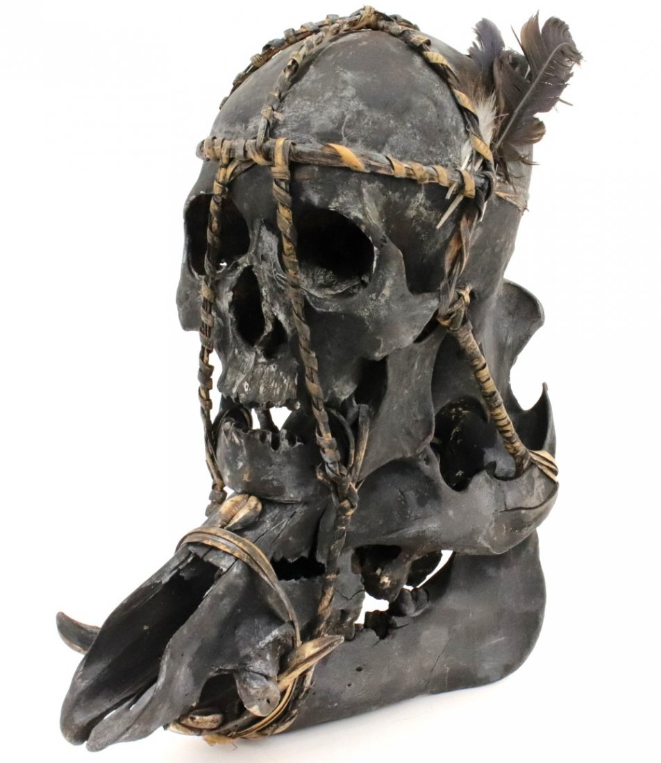Impressive Museum Display of Indonesian Dayak Headhunte: Rare Museum Display of Indonesian Dayak Headhunter's Human Skull ~ Trophy Decoration, mounted on top of the wild boar skull. Detailed condition reports are not included in this catalog. For additional