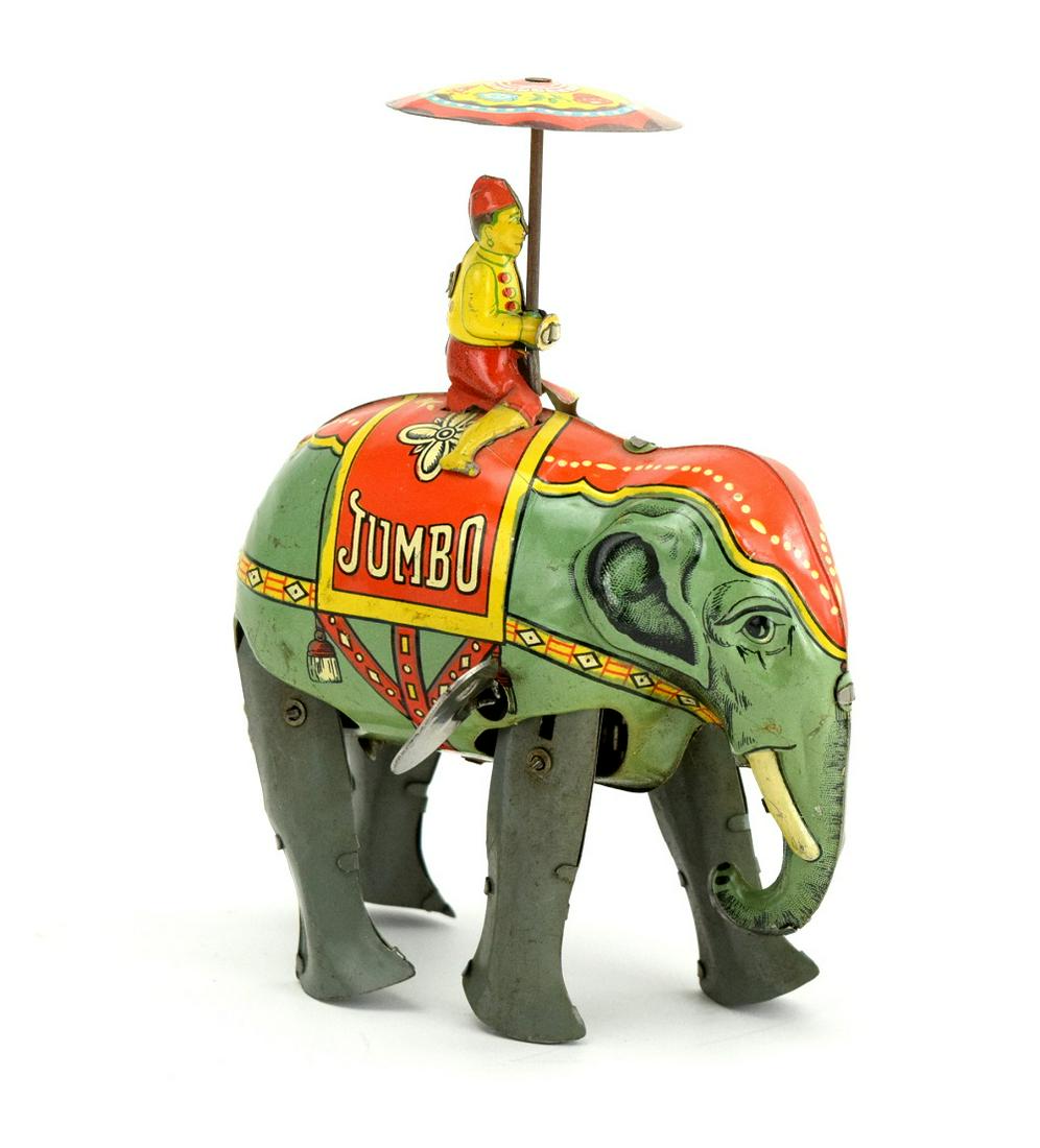 Blomer & Schuler, U.S.Zone Germany: B&S "Jumbo" Boy on Elephant, US Zone Germany, tin windup toy. Great original condition with almost no signs of usage.windup mechanism is in working condition.Toy is 6" height.