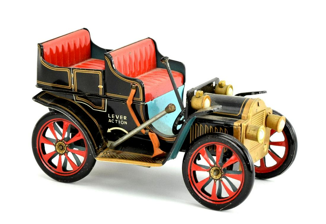 VINTAGE TIN LITHO LEVER ACTION JAPAN CAR TRADE MARK: Vintage Japan car Trade Mark Modern Toys. Car has a black exterior with blue/red interior. The lever on the side of the car works and moves the rear wheels. Paint is in great condition with minimal lo
