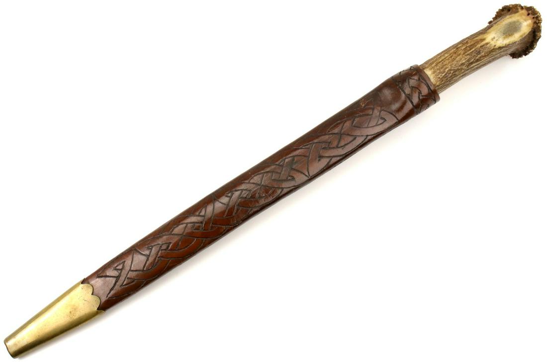 Unusual Scottish Officer's Dirk Long Dagger with: Unusual Scottish Officer's Dirk Long Dagger with Double-Edged Blade, Large Stag Grip & Beautiful Tooled Leather Scabbard. Total length (inside scabbard if present) : 18 1/2", Blade length :13 1/2". ~~