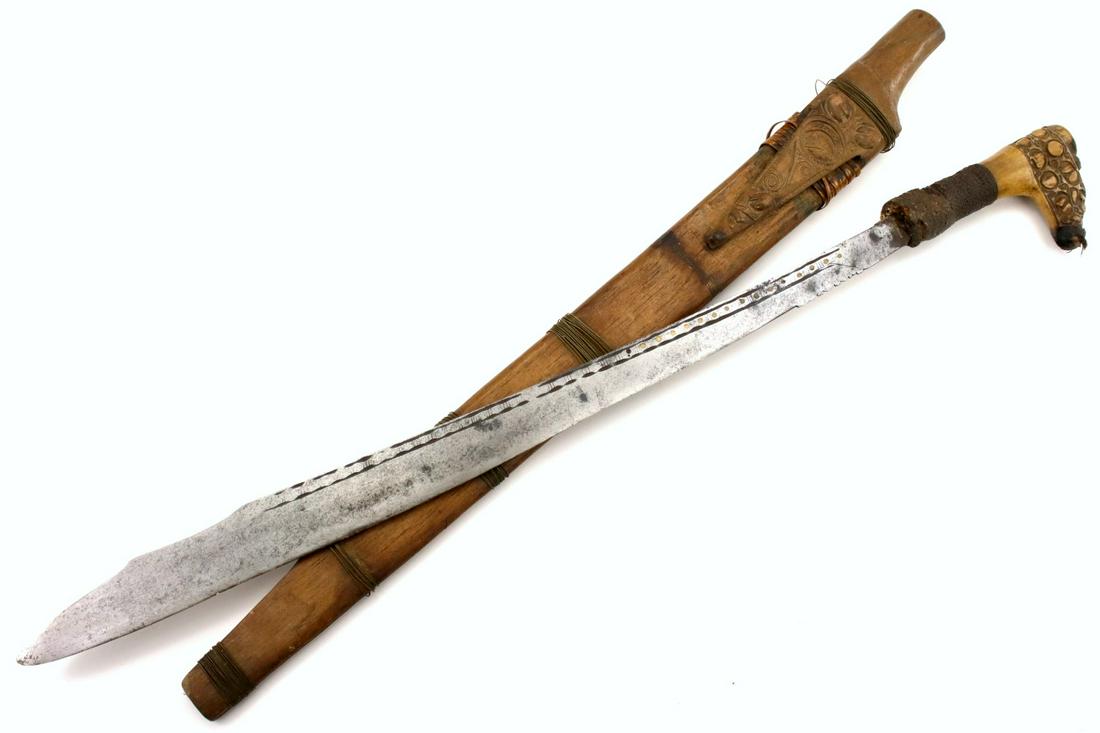 Antique Indonesian Tribal MANDAU Sword ~ Used by Borneo: Antique Indonesian Tribal MANDAU Sword ~ Used by Borneo DAYAK Tribe Headhunters ~ Carved Bone Grip ~ Famous SCHMIEDT Collection. Total length (inside scabbard if present) : 26 3/4", Blade length : 19 