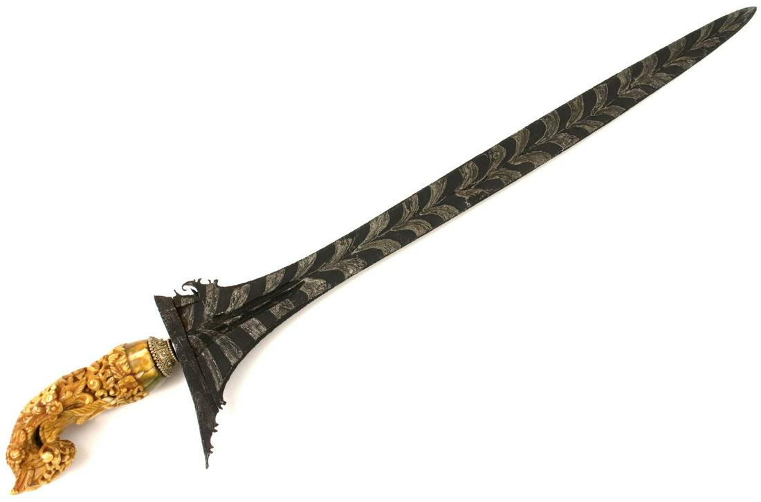 Rare Antique Indonesian KERIS Dagger with Exquisite: Rare Antique Indonesian KERIS Dagger with Exquisite Carved Grip & Unique Damascus Steel Blade. Total length (inside scabbard if present) : 18", Blade length :14 1/4 ". PLEASE NOTE : Shipping Only With