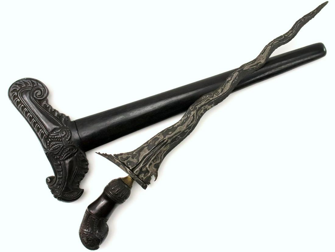 Nice Antique Indonesian KERIS Dagger in Well Carved: Nice Antique Indonesian KERIS Dagger in Well Carved Wood Mounts ~ Distinctively Patterned Damascus Steel Blade. Total length (inside scabbard if present) :20 1/2 ", Blade length : 14 1/2". ~~~~~~ DEAR