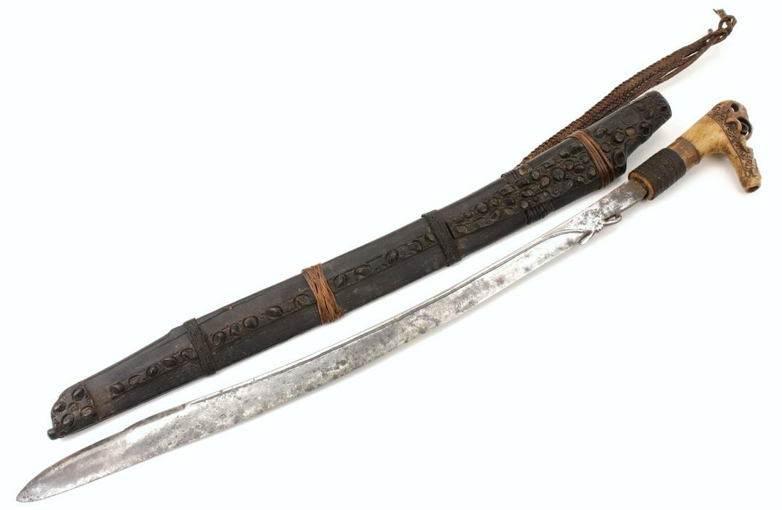 Antique Indonesian Tribal MANDAU Sword ~ Used by Borneo: Antique Indonesian Tribal MANDAU Sword ~ Used by Borneo DAYAK Tribe Headhunters with Carved Bone Grip & Unusual Blade. Total length (inside scabbard if present) : 27 1/4", Blade length : 21". ~~~~~~ D