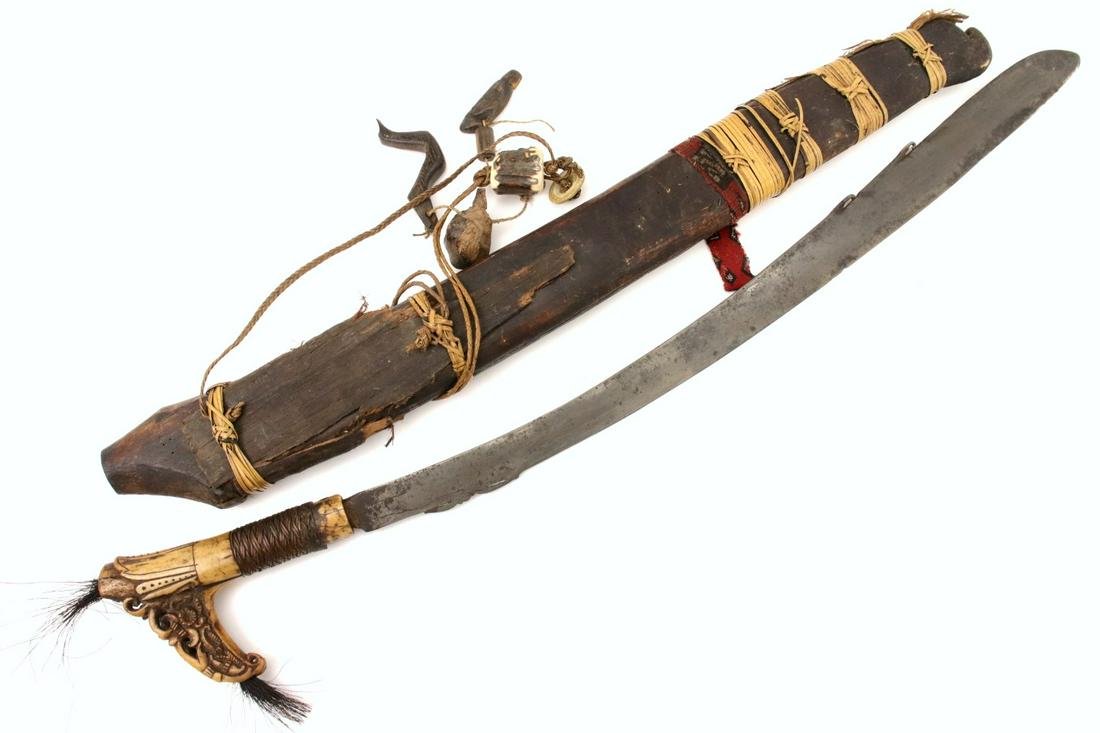 Antique Indonesian Tribal MANDAU Sword ~ Used by Borneo: Antique Indonesian Tribal MANDAU Sword ~ Used by Borneo DAYAK Tribe Headhunters ~ Fine Carved Bone Grip. Total length (inside scabbard if present) : 27 3/4", Blade length :21 1/4". ~~~~~~ DEAR BIDDERS