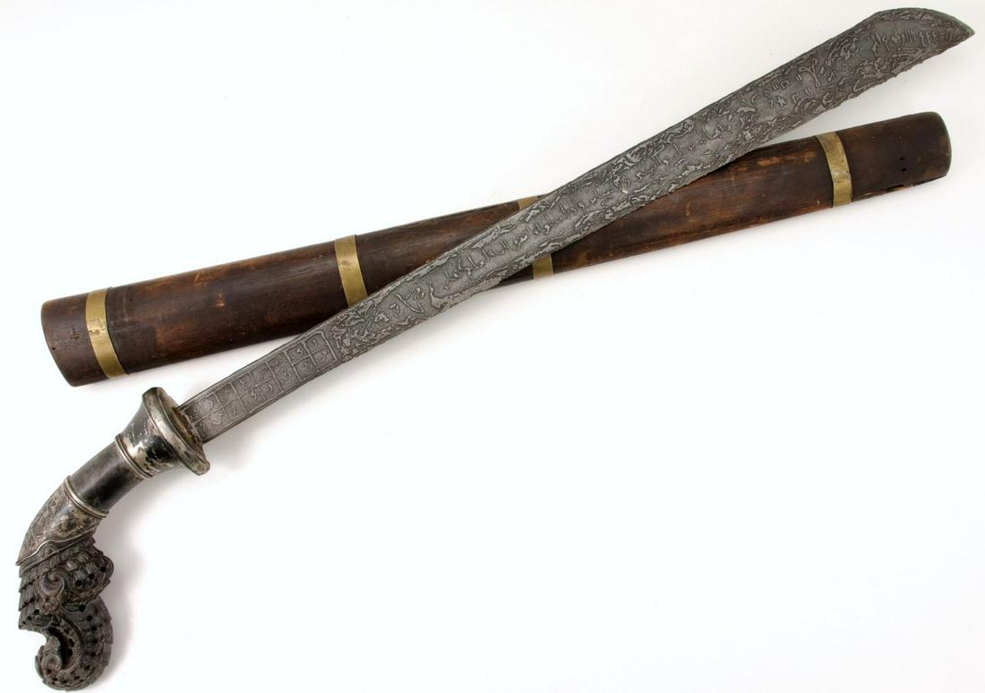 Fine & Rare Antique Indonesian GOLOK Sword with Etched: Fine & Rare Antique Indonesian GOLOK Sword with Etched Scripts on Blade & Fine Carved Horn Hilt in Silver Mounts. Total length (inside scabbard if present) : 27 1/2", Blade length : 20 1/2". ~~~~~~ DE