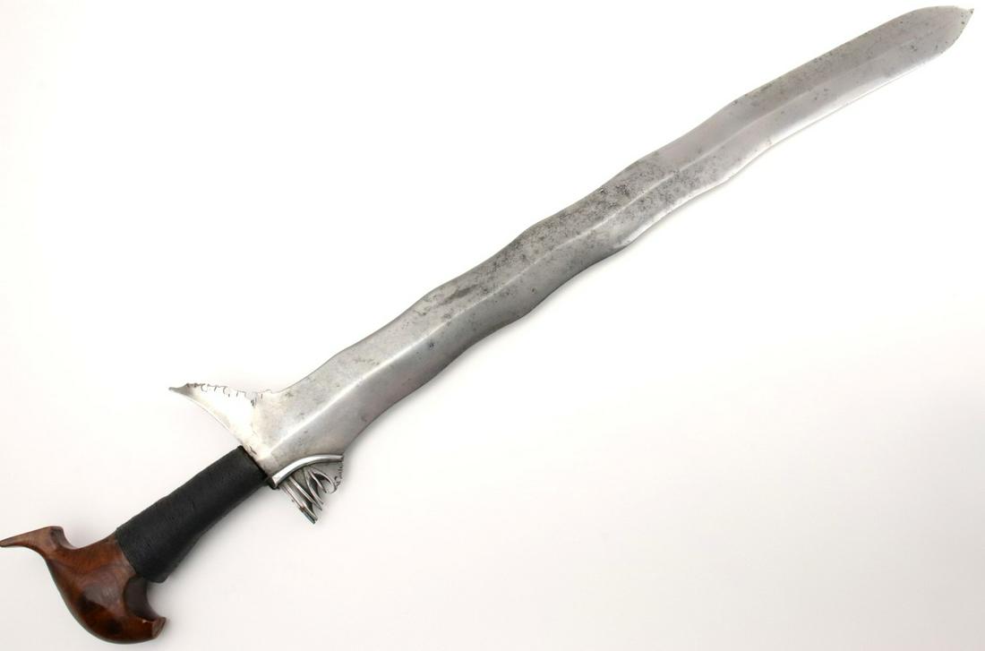 Good Antique Philippine Moro Sulu KRIS Battle Sword: Good Antique Philippine Moro Sulu KRIS Battle Sword with Nice Carved Two-tone Wood Cockatoo Pommel. This is a classic sword of the Moro people of the southern Philippines and of the Sulu Sea areacalle