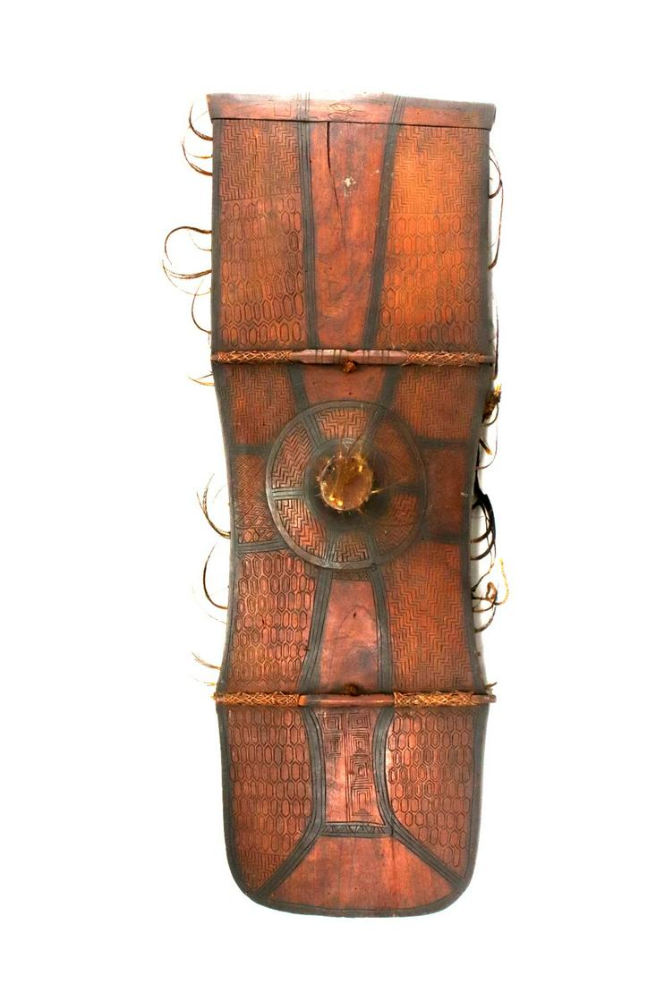 Rare 19th C. Asian Philippine BAGOBO Tribe Large Shield: Rare 19th C. Asian Philippine BAGOBO Tribe Large Shield Armor. Bagobo people, large rare shield carved from a single large piece of wood with separate lower border, with a raised central boss, well in