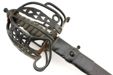 Good 19th C. Scottish Basket Hilt Broad Sword with Rare Scabbard.: Good 19th C. Scottish Basket Hilt Broad Sword with Rare Scabbard. In its iron furniture having black paint finish and a very fine shark skin grip. Wearing a strong double edged blade with a short