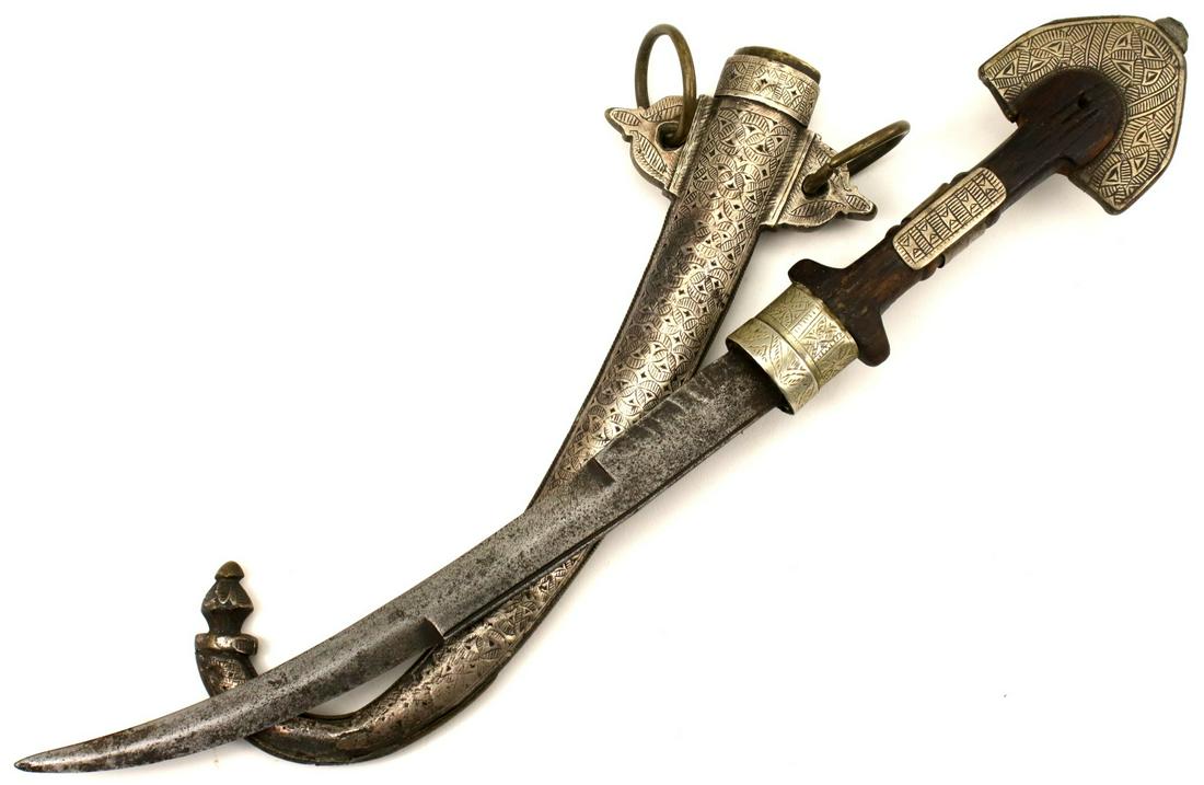 Good Antique Islamic Arabic Arab Moroccan KOUMIYA Dagger in Silver & Brass Mounts ~ Rare Maker: Good Antique Islamic Arabic Arab Moroccan KOUMIYA Dagger in Silver & Brass Mounts ~ Rare Maker Marked Blade. Total length (inside scabbard if present) : 17 1/2", Blade length : 10 ". ~~ DEAR BIDDERS,