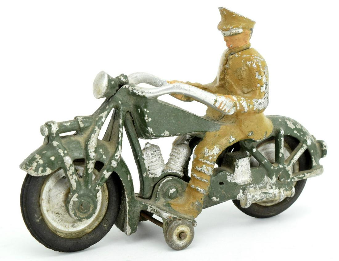 Vintage 1930s Toy MOTORCYCLE POLICE MAN: Original 1930s Motorcycle Police Man. Great patina and original rubber tires. Some spots of missing paint. Detailed condition reports are not included in this catalog. For additional information, incl