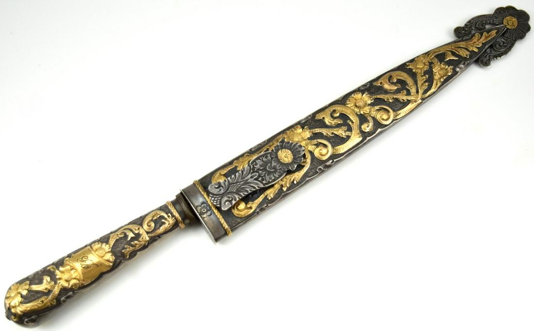 Fine Large Latin American Argentina Cowboys Gaucha Knife - Chiseled Gilded Mounts: Fine Latin American Argentina Cowboys Gaucha Knife - Chiseled Gilded Mounts. Blade with the sign "La Mavediza" Industria Argentina. Scabbard marked on the throat. Excellent example. Total length (insi