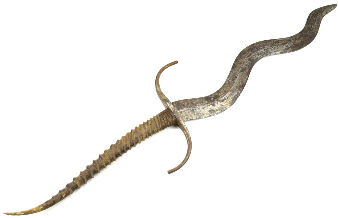 Unusual South East Asia Dagger with Gazelle Horn Grip: Unusual South East Asia Dagger with Gazelle Horn Grip with strong wavy blade. Total length (inside scabbard if present) : 27 5/8", Blade length : 15 1/2". ~~ DEAR BIDDERS, Please View More Detailed Cl