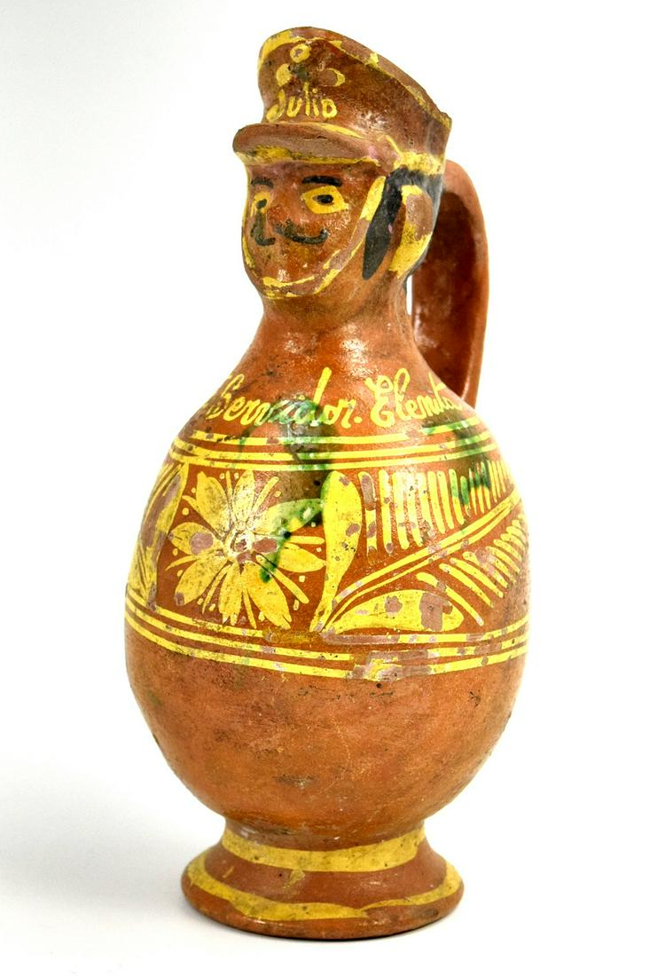 Antique Unique Mexican Folk Art Pulgue Pottery Military Pitcher: Antique unique Mexican folk art Pulgue pottery military design pitcher decorated with "Julio" soldier head. 11 1/4" height and 5" diameter.~~ DEAR BIDDERS, Please View More Detailed Close-Up Images by