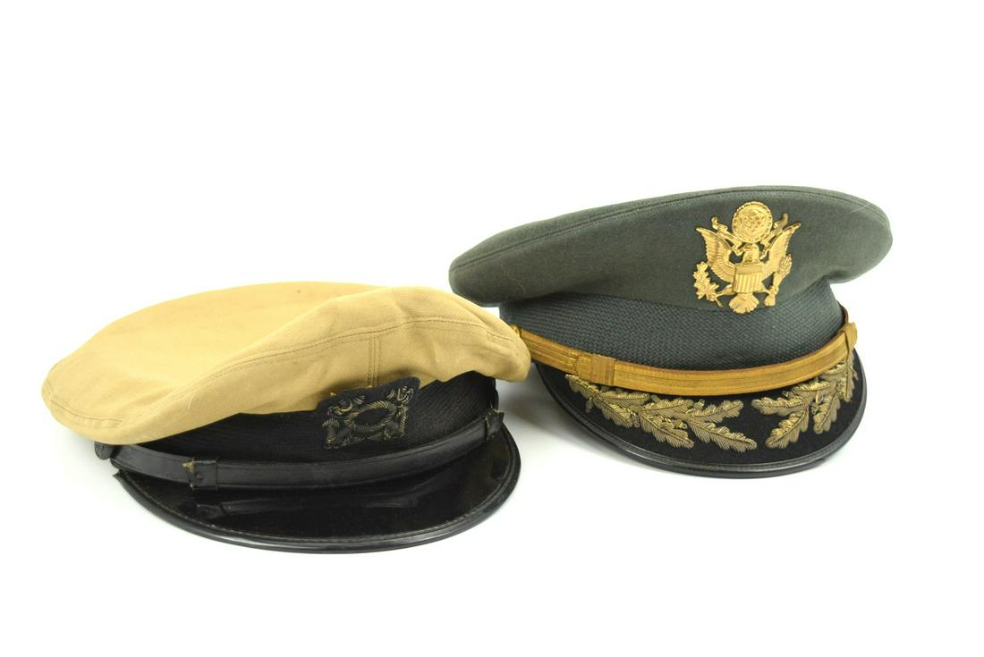 Pair Original US Navy and Army Officers Visor Caps: A very fine example of the pair dress uniform visor caps. One is field Grade U.S. Army infantry officer, circa World War II era. The cap is dark green wool. The wool surface of the visor is embroidere