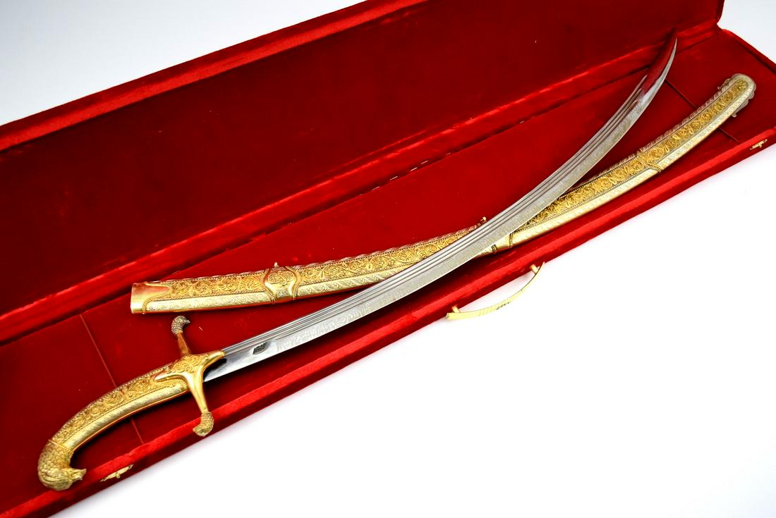 FINE SOVIET ERA CAUCASIAN PRESENTATION SHAMSHIR SHASHKA SWORD IN SILVER & GILT: Fine soviet era caucasian presentation shamshir shashka sword in silver & gilt. Nicly maker marked blade with excellent crafstmaship to the scabbard, handle and grip. Comes with specially made case. .