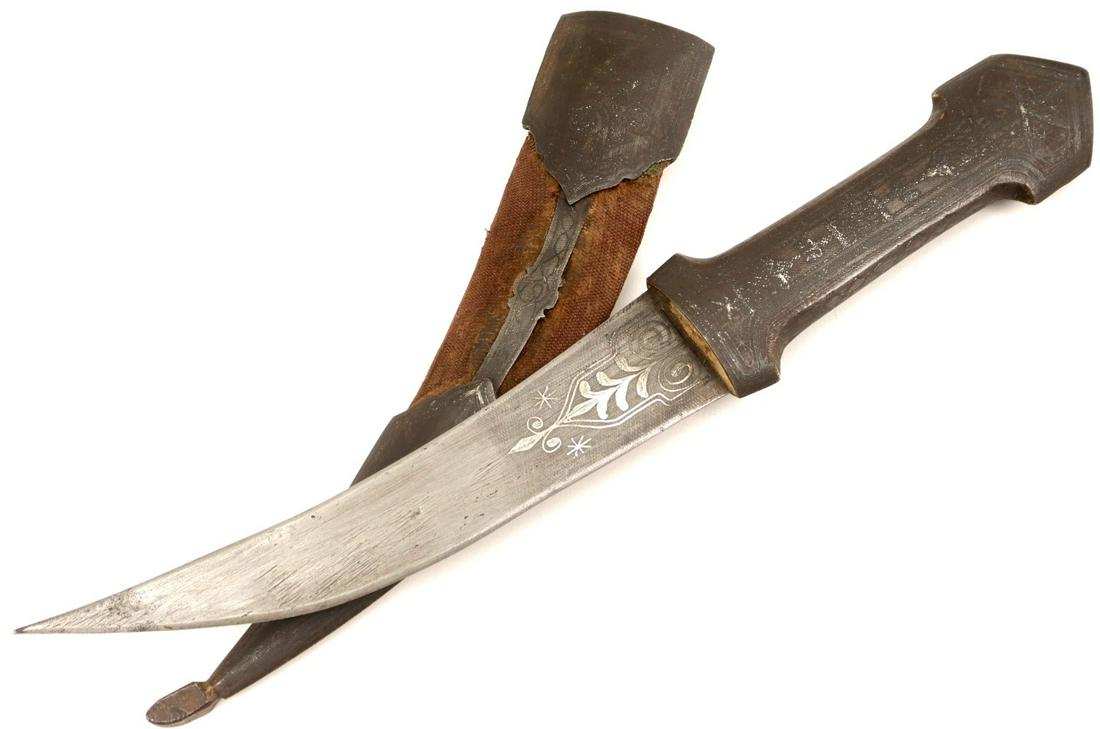 ANTIQUE ISLAMIC SYRIAN JAMBIYA DAGGER IN SILVER DAMASCENED STEEL MOUNTS: Antique Islamic Syrian JAMBIYA Dagger in Silver Damascened Steel Mounts. Total length (inside scabbard if present) : 13 1/2 ", Blade length : 6 3/4". ~~ DEAR BIDDERS, Please View More Detailed Close-U