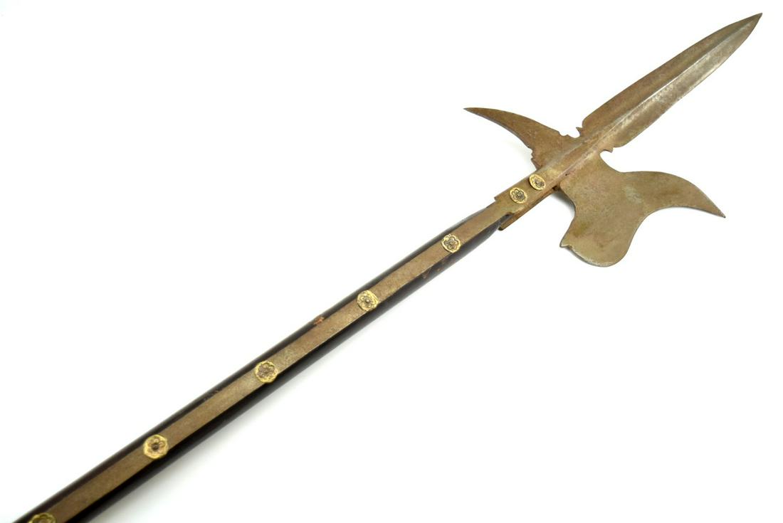 19TH CENTURY EUROPEAN HALBERD POLEARM WITH AXE HEAD: 19th Century, Victorian Period European Halberd Polearm. 100" overall with a 15 1/2" blade spike, and an 8 1/4" axe head. The head is mounted to the round wooden shaft by integral iron bands mounted t