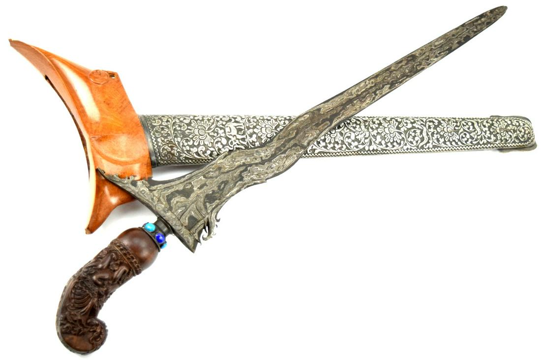 VERY FINE 19TH C. INDONESIAN KERIS DAGGER WITH METEORITE IRON DAMASCUS STEEL BLADE & SUPERB CARVED: Very Fine 19th C. Indonesian KERIS Dagger with Meteorite Iron Damascus Steel Blade & Superb Carved Grip. Total length (inside scabbard if present) : 19 1/2", Blade length : 15 5/8". ~ . Detailed condi