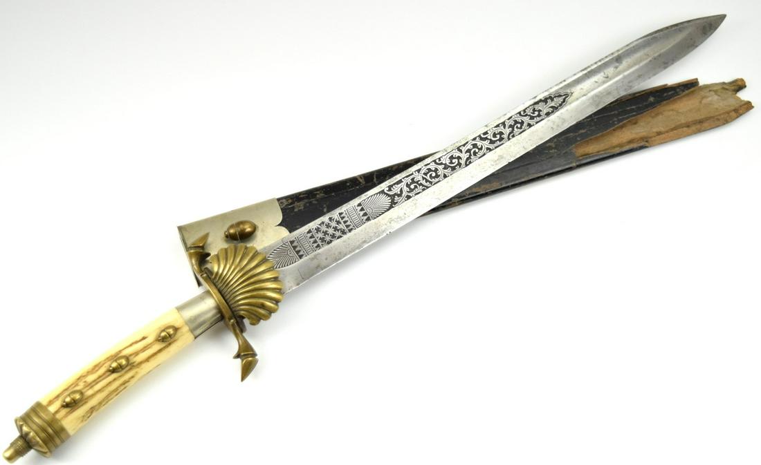 German Hunting Dagger with Engraved Blade: German Hunting Dagger with Engraved Blade. Marked at ricasso. Brass shell guard and matching mounted pommel. Partial scabbard. Most likely reproduction. Total length (inside scabbard if present) : 20