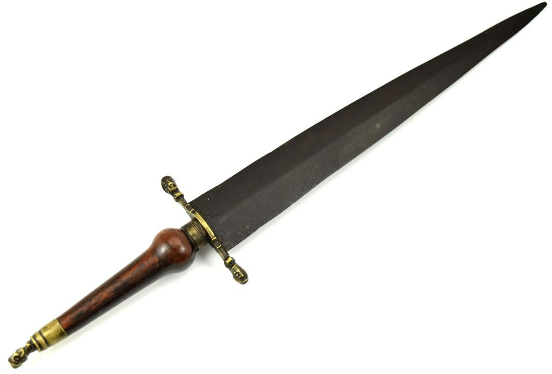American Revolution Period British Plug Bayonet: 17th Century to American Revolution Period British Plug Bayonet. Double edged dark steel blade qith brass mounted guard and pommel with knight head at the ends. Round Wooden handle. Total length (insi
