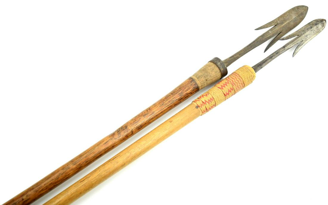 Early 20th C. Two Long Indonesian Pikes Pole Arms: Early 20th C. Two Long Indonesian Pikes Pole Arms. Dimensions: 1. Total length : 63", Blade length : 8 3/4" x 1 5/8" . 2. Total length : 57 1/2", Blade length : 10" x 2". Detailed condition reports ar