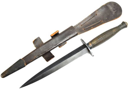 WWII Fairbairn-Sykes Commando Dagger Fighting Knife: Fairbairn-Sykes Fighting Knife. and Leather Scabbard. Oval steel guard marked: ENGLAND with arrow on the other side. Ribbed grip with ball pommel. Contained in brown leather scabbard with brass tip To