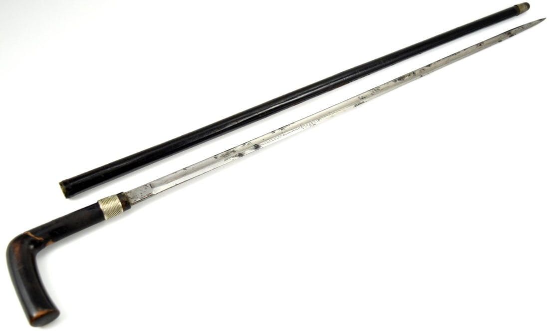 19th c. continental walking cane with full size sword blade: 19th C. Continental Walking Cane with Full Size Sword Blade. Blade marked "F.W.H". Solingen on the reverse. Total length (inside scabbard if present) : 34 7/8", Blade length : 27 7/8".~~. Detailed con