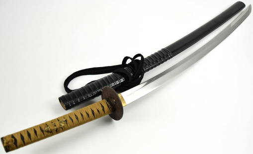 Long Japanese Samurai Katana Sword Signed Horii Toshihide: Gendaito, 28 inch length of cutting edge, signed Horii Toshihide, very large pattern Bizen Ichimonji style hamon, modern saya and tsuka with antique tsuba. Total length (inside scabbard if present) :