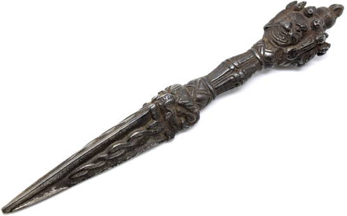 Antique Tibet Dagger/ Vajra Dorje: A rare piece. This dagger is intricately carved as you can see from the photos. These are difficult to find in today's market as this type of workmanship is not being produced these days. Size: 8 1/2"