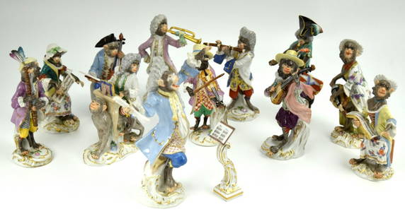 Authentic Meissen Porcelain Germany 12 Piece Monkey Orchestra Band: An original first quality Meissen porcelain 12 piece Monkey Orchestra figurines set depicting monkeys playing musical instruments sculpted after the models by J.J. Kandler. Each on a gilt edged Rococo