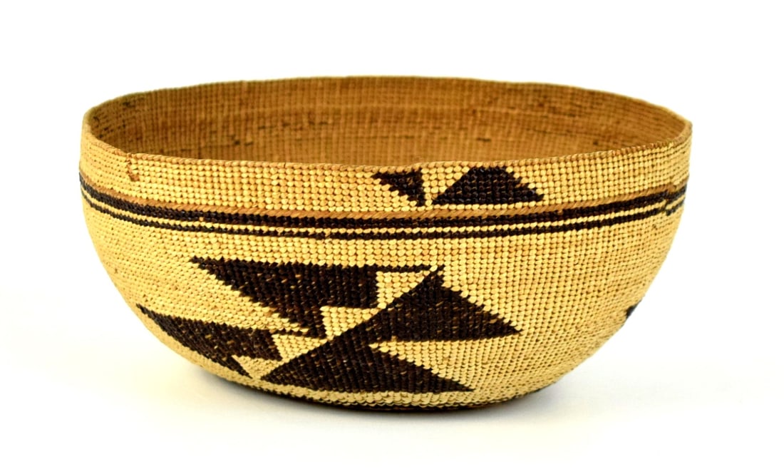 A CIRCA 1920 HUPA CALIFORNIA INDIAN BASKETRY HAT: Hupa/Yurok basketry hat. A woven hat with hazelnut warp and finely split pine root weft in a twining technique. Both Hupa and Yurok women wore these woven basketry hats as 'dress hats' in their ceremo
