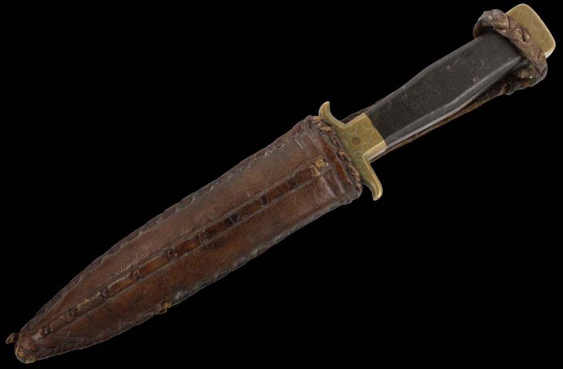 Unique WW II US American Marine or Soldier Fighting Dagger Knife with Serrated Back-edge Blade &: Unique WW II US American Marine or Soldier Fighting Dagger Knife with Serrated Back-edge Blade & Well Crafted Leather Scabbard. Engraved Brass Mounts & Ebony Grips. Total length (inside scabbard if pr