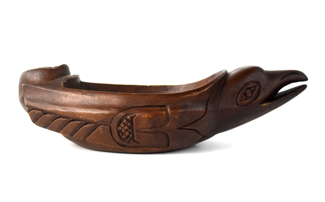 Alaskan Wooden Carved Oil Bowl In Raven Shape: This raven oil bowl wooden carved and attributed to original Amos Wallace carvings. The color is very good. Unsigned.Often referred to as a "grease bowl", these wooden personal bowls were produced to 