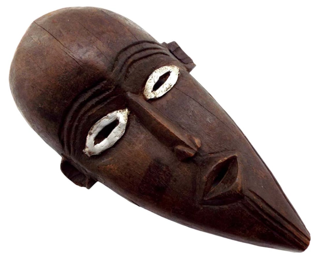VINTAGE OR ANTIQUE AFRICAN TRIBAL DARK WOOD FACE MASK WITH WHITE METAL EYES.: VINTAGE OR ANTIQUE AFRICAN TRIBAL DARK WOOD FACE MASK WITH WHITE METAL EYES. TOTAL LENGTH IS 15", 8" WIDE and 5" HIGHT. Detailed condition reports are not included in this catalog. For additional info